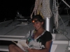Jessica reading on the foredeck
