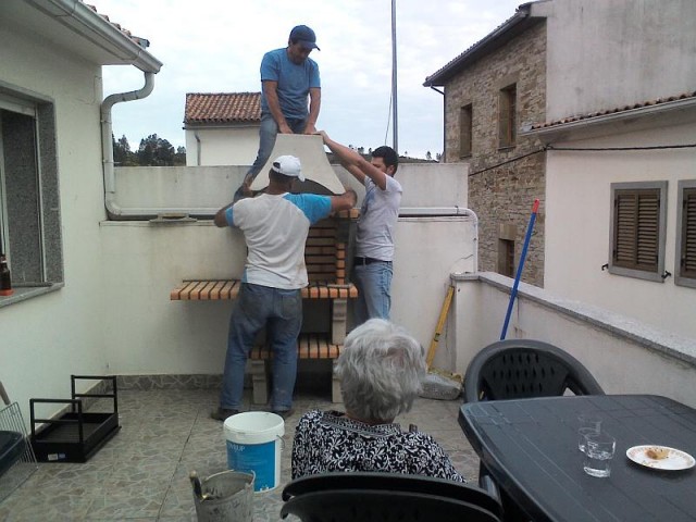 Mum supervising the construction of a new barbeque at Ceu's mom's house in Casegas
